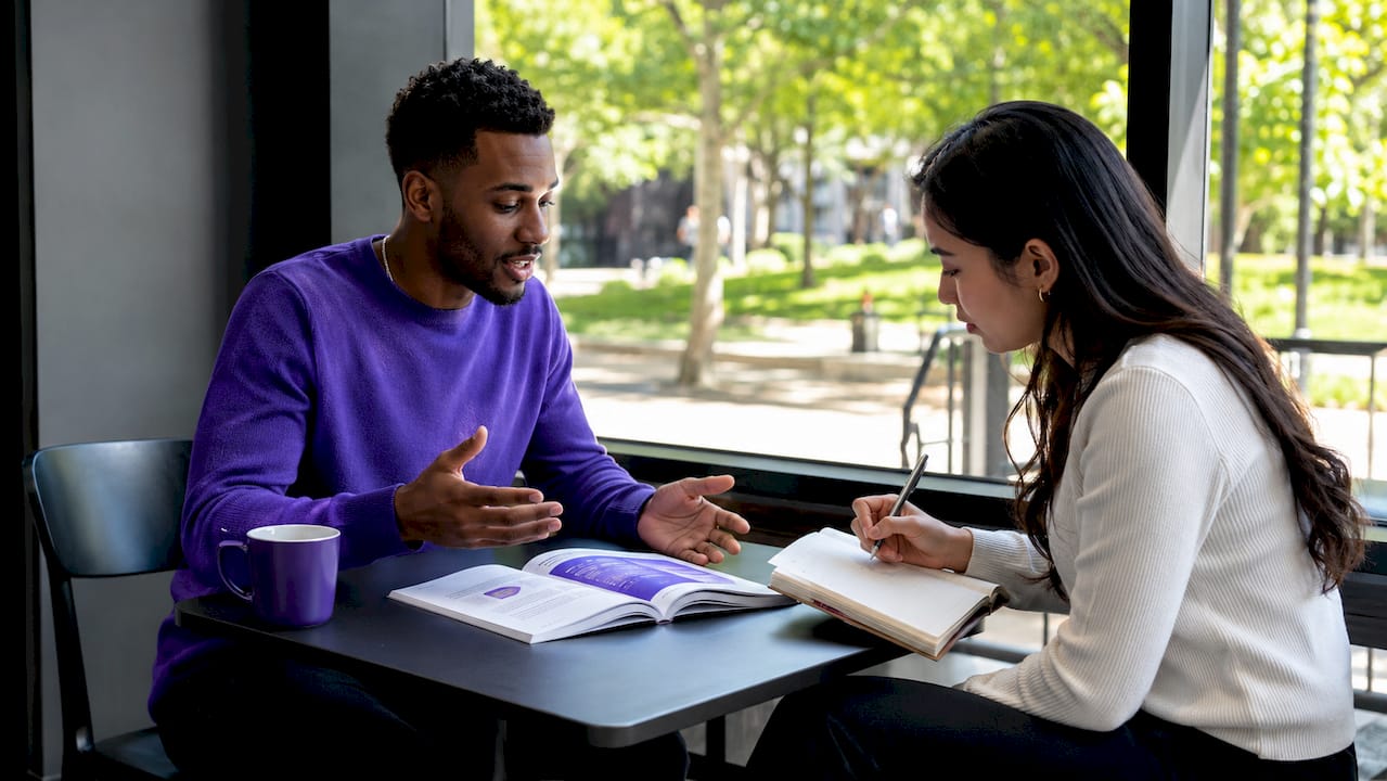 Two sales reps discussing transition playbook